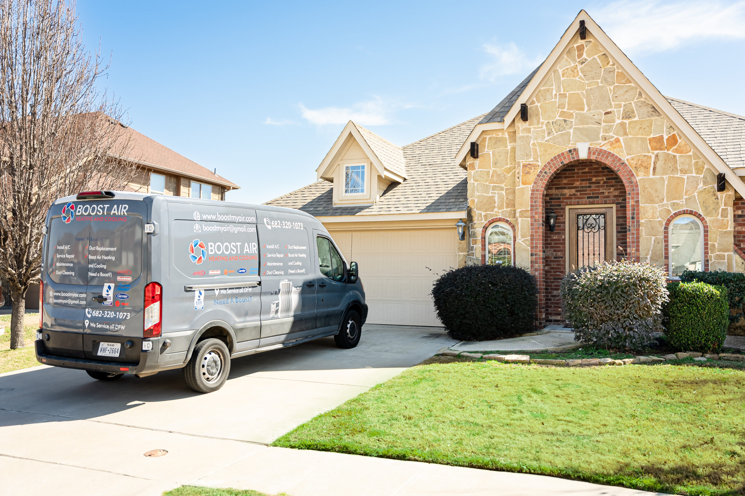 Boost Air And Plumbing service van on a residential job in North Texas