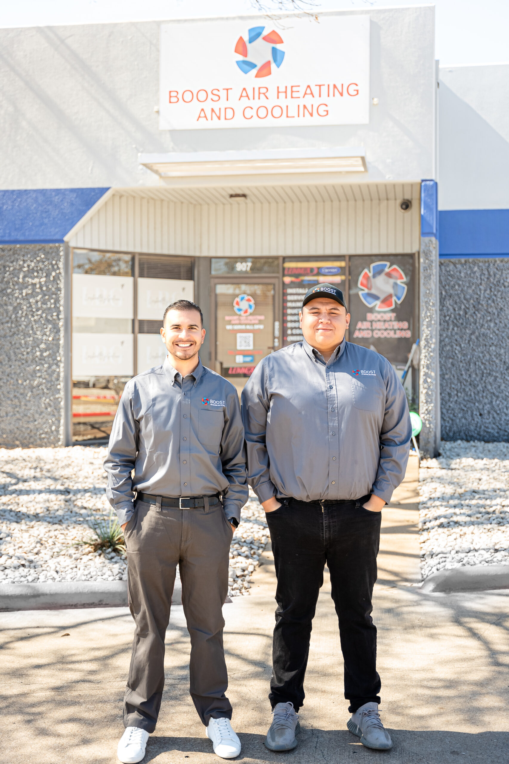 Boost Air And Plumbing crew with company service van outside the Arlington, TX shop
