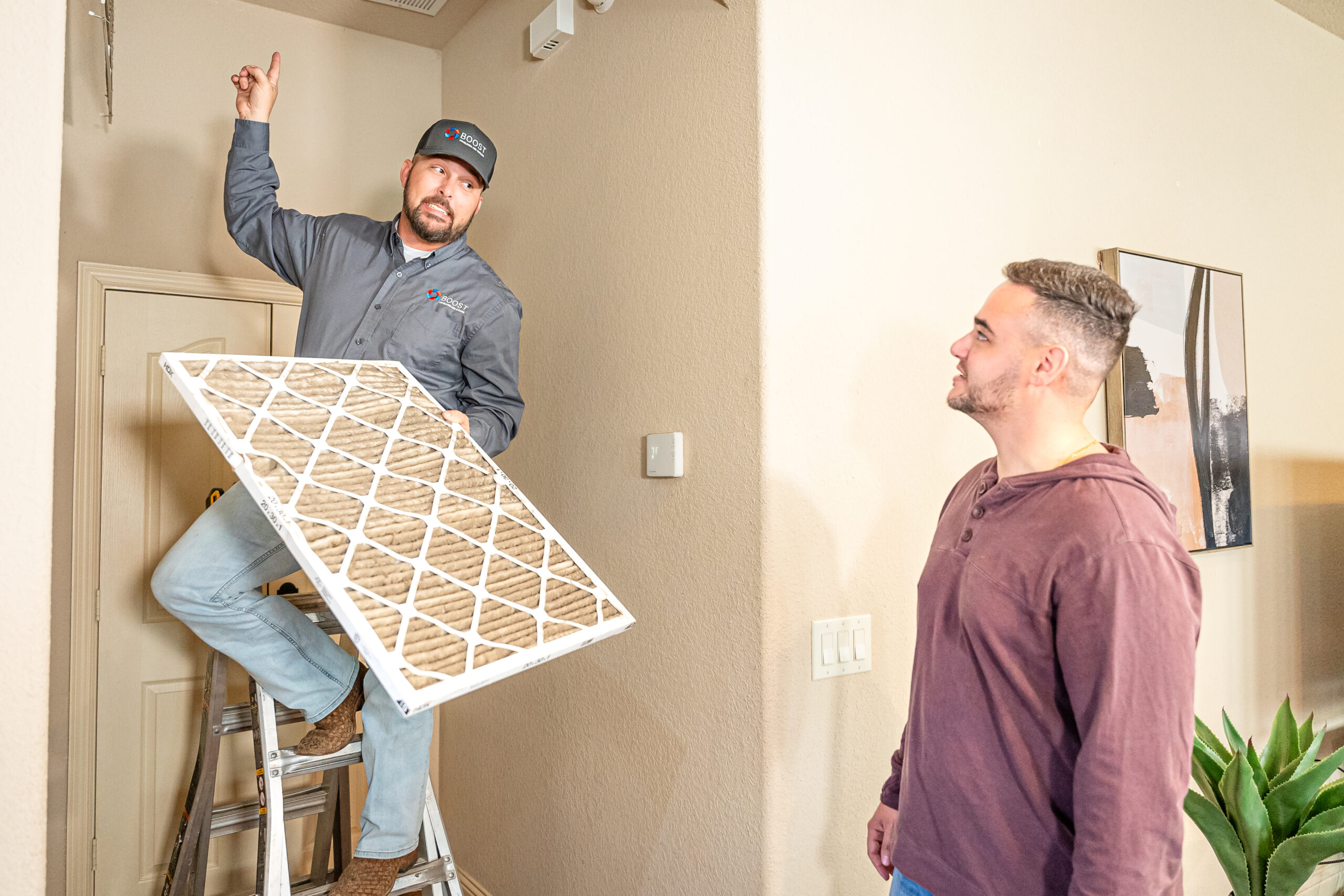 Boost Air technician diagnosing an HVAC system